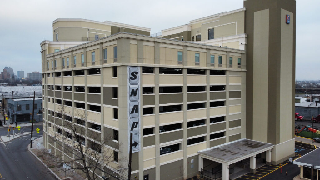 Modern parking garage with SNAP sign.